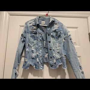 Ripped blue jean jacket